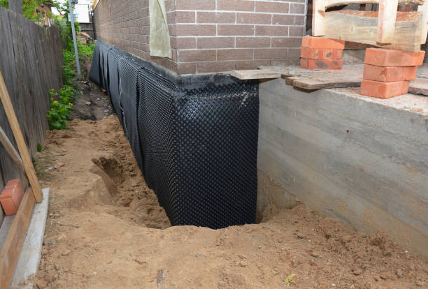 Happy homeowners after waterproofing job in Madison